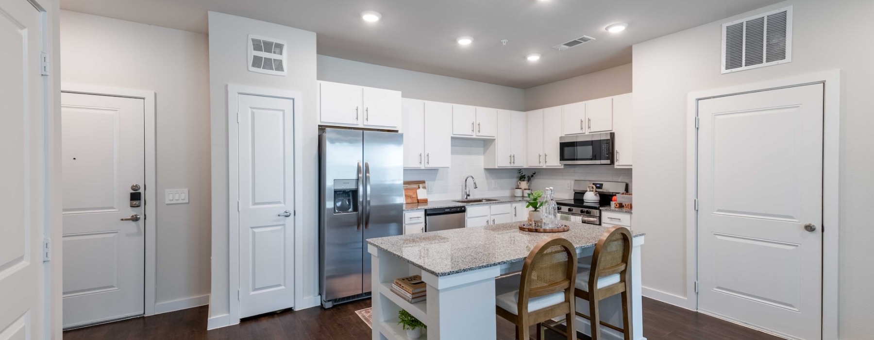 a kitchen with white cabinets