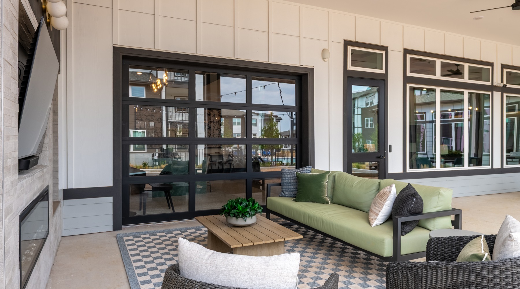 Outdoor lounge with chair and TV
