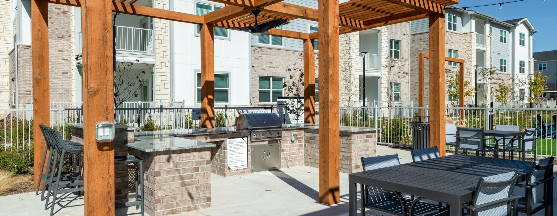 a patio with tables and chairs